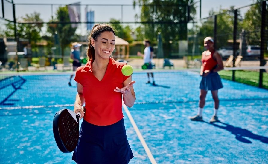 from tennis to padel happy female padel player on court