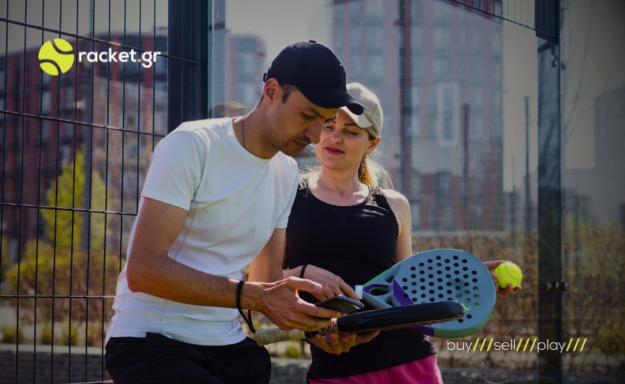 male and female padel players on the phone on a padel court holding rackets in hand